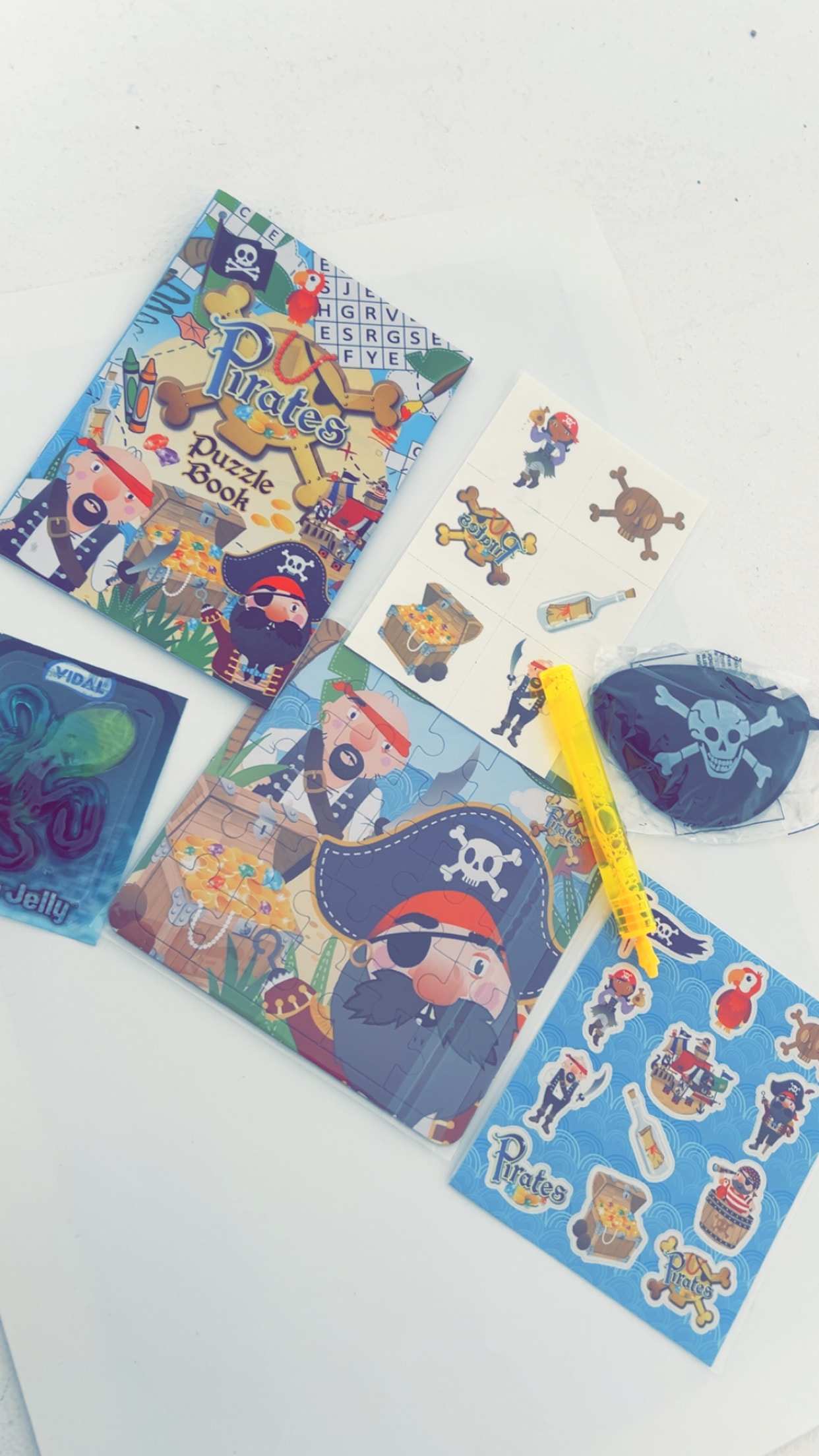 Pirate themed children's party bags with goodies including gold coins, stickers and activity sheets